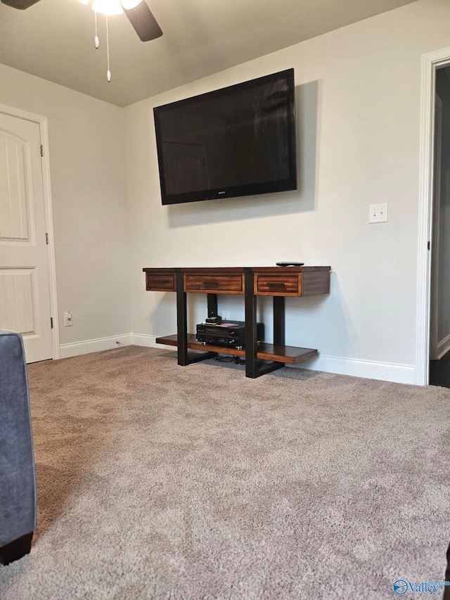 unfurnished living room with carpet flooring and ceiling fan