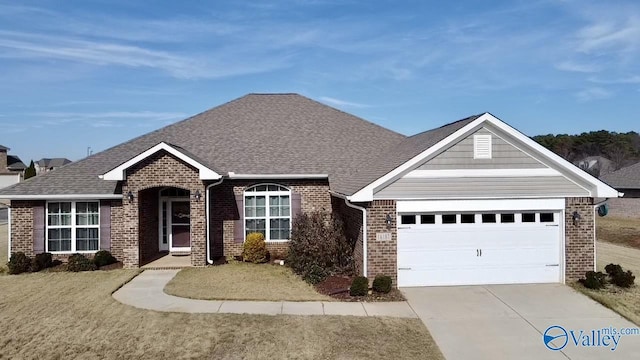 view of front of house featuring a garage and a front lawn