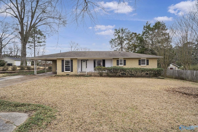 ranch-style house featuring a carport, concrete driveway, and fence