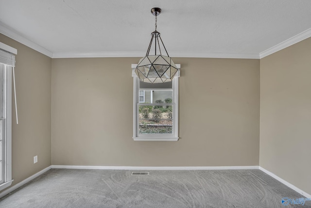 empty room featuring ornamental molding, baseboards, visible vents, and carpet flooring