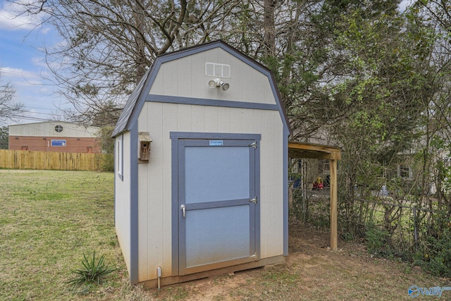 view of shed with fence