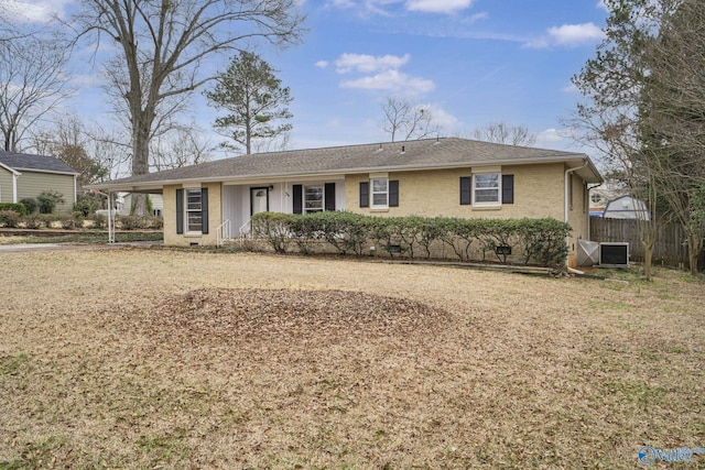 single story home with central AC, brick siding, a shingled roof, and fence