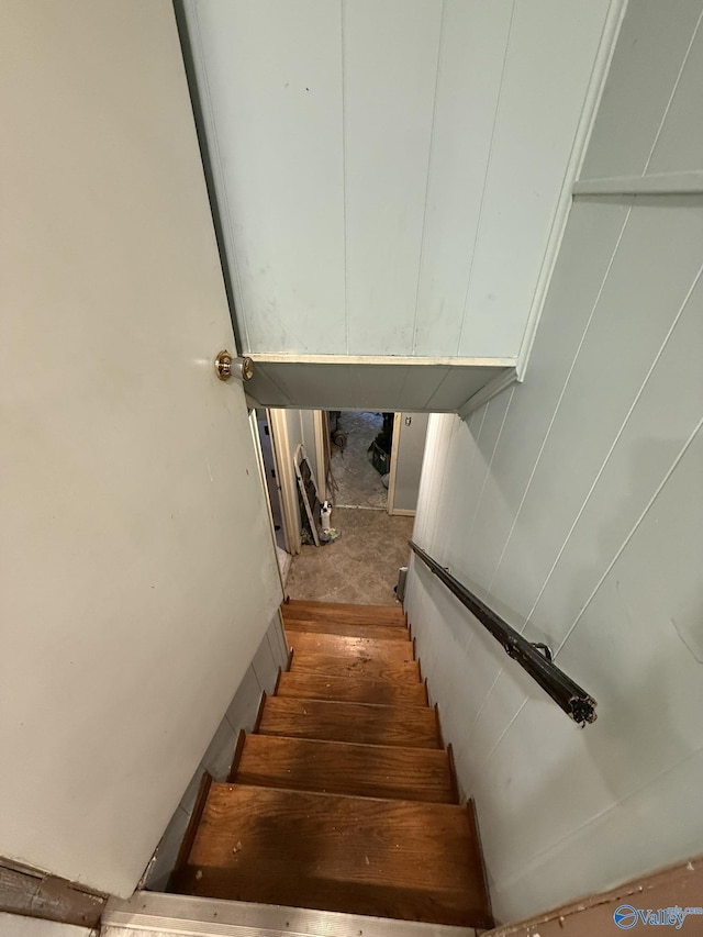 staircase featuring wood finished floors