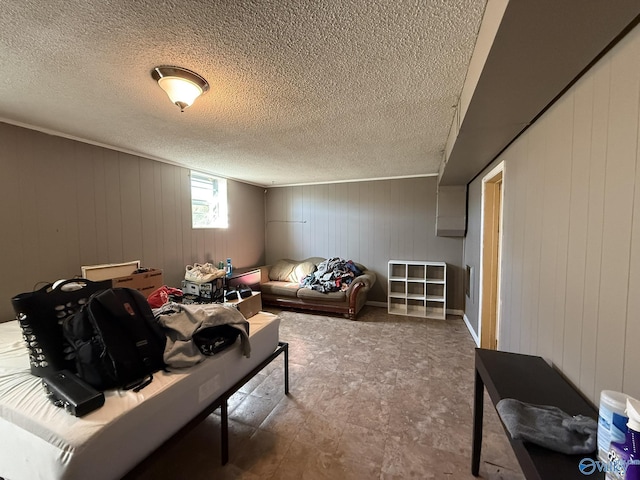 interior space with a textured ceiling and tile patterned floors