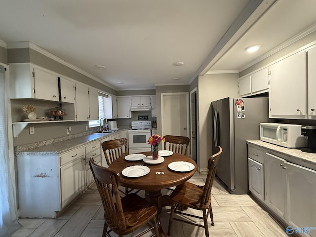 kitchen featuring open shelves, white appliances, a sink, and white cabinets