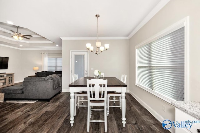 dining room with plenty of natural light, ornamental molding, dark wood finished floors, and baseboards