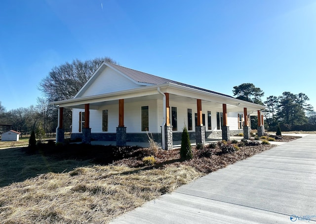 view of side of home featuring a porch