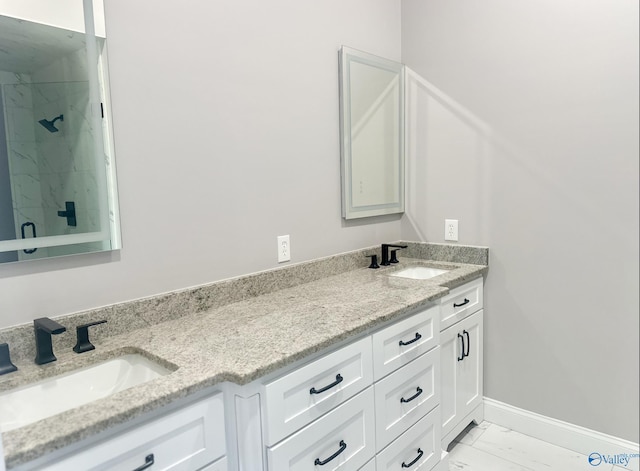 bathroom featuring walk in shower and vanity