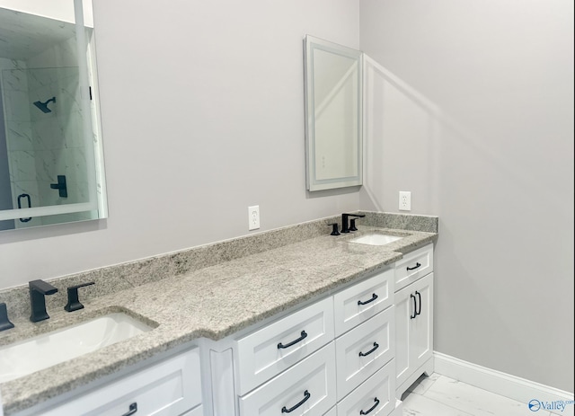 bathroom with vanity and tiled shower