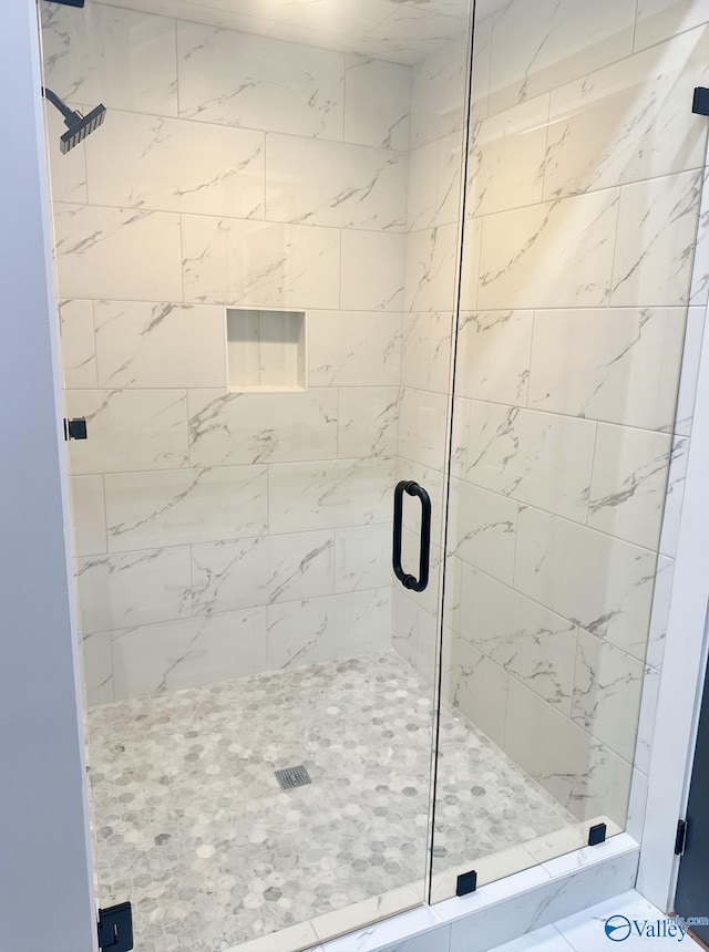 bathroom featuring an enclosed shower