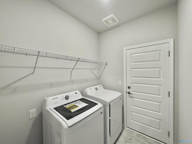 211 Shangrila Way, Meridianville, AL 35759 - laundry area featuring washing machine and dryer and light marble finish flooring