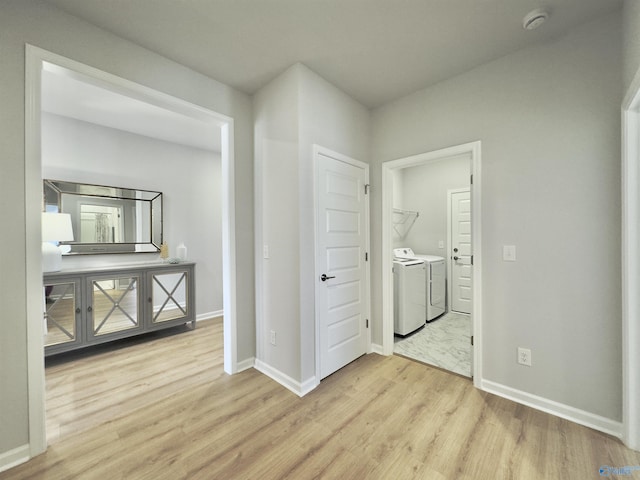 211 Shangrila Way, Meridianville, AL 35759 - hall with separate washer and dryer, light wood-type flooring, and baseboards