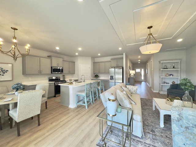 211 Shangrila Way, Meridianville, AL 35759 - living room with light wood finished floors, a chandelier, recessed lighting, and baseboards