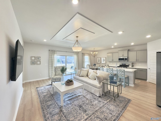 211 Shangrila Way, Meridianville, AL 35759 - living room featuring a chandelier, light wood-style flooring, recessed lighting, and baseboards