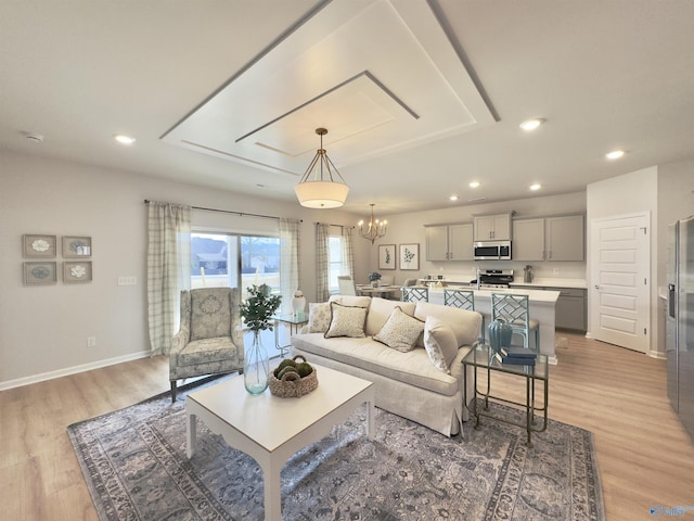 211 Shangrila Way, Meridianville, AL 35759 - living room featuring recessed lighting, light wood-style flooring, a chandelier, and baseboards
