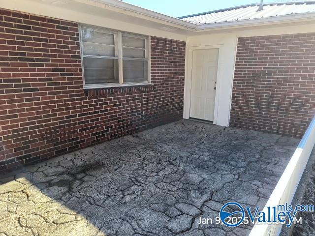 property entrance with a patio