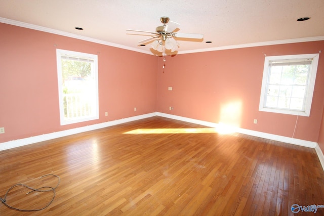 unfurnished room with hardwood / wood-style floors, ceiling fan, and ornamental molding