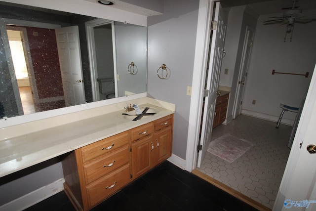 bathroom featuring tile patterned floors, ceiling fan, vanity, and toilet