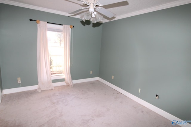 carpeted spare room with a textured ceiling, ceiling fan, and ornamental molding