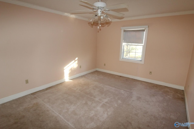 empty room featuring ceiling fan, ornamental molding, and light carpet