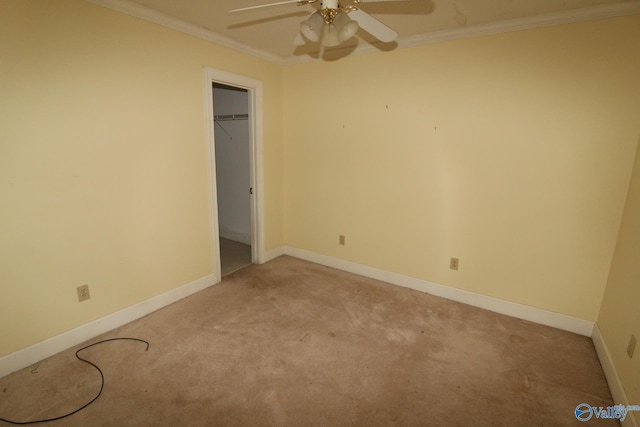 unfurnished bedroom with light carpet, a closet, ceiling fan, and crown molding