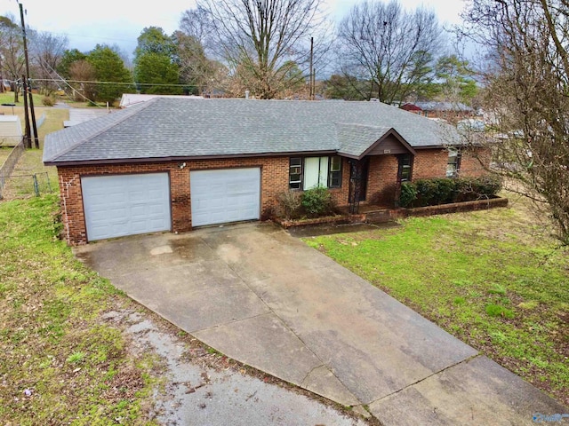 ranch-style home featuring a garage, driveway, a shingled roof, and brick siding