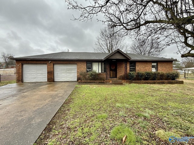 ranch-style house featuring a garage, a front yard, brick siding, and driveway