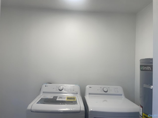 laundry room with laundry area and washing machine and clothes dryer