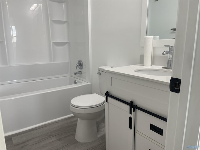 full bathroom with toilet, tub / shower combination, wood finished floors, and vanity