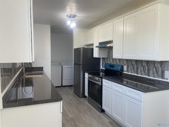 kitchen with stainless steel appliances, separate washer and dryer, backsplash, and under cabinet range hood