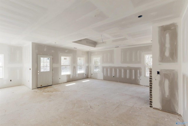 unfurnished room with a tray ceiling