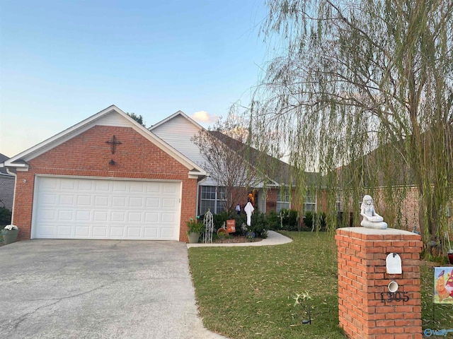 view of front facade with a front yard and a garage