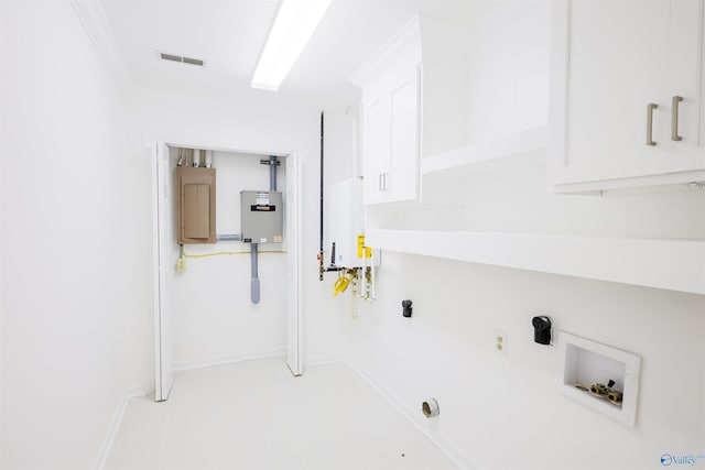 clothes washing area with washer hookup, electric panel, baseboards, cabinet space, and crown molding