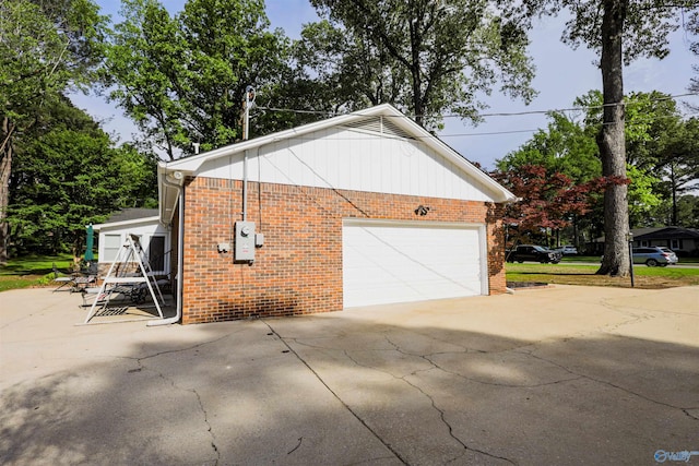 garage featuring driveway