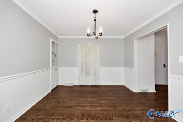 unfurnished dining area featuring a notable chandelier, dark hardwood / wood-style floors, and crown molding