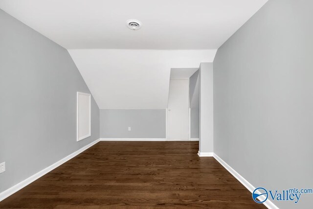 2512 Vista Dr SE, Huntsville, AL 35803 - bonus room with dark wood-type flooring, vaulted ceiling, and baseboards