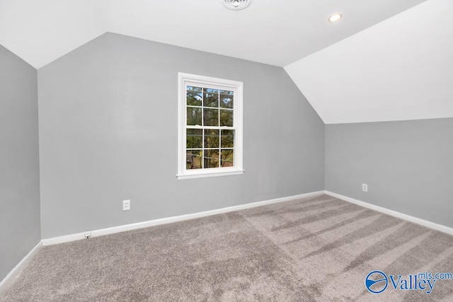 bonus room featuring carpet and lofted ceiling