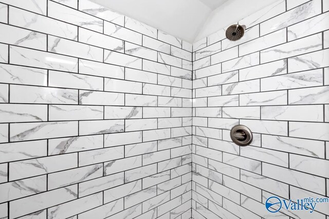 2512 Vista Dr SE, Huntsville, AL 35803 - bathroom with a tile shower and vaulted ceiling