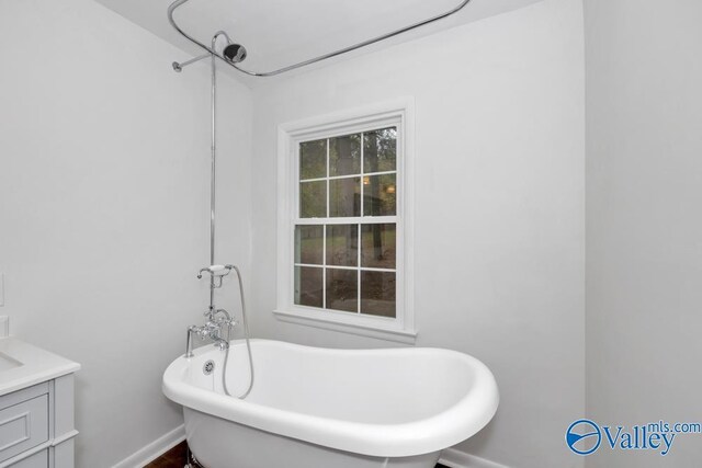 2512 Vista Dr SE, Huntsville, AL 35803 - bathroom with a freestanding bath, baseboards, and vanity
