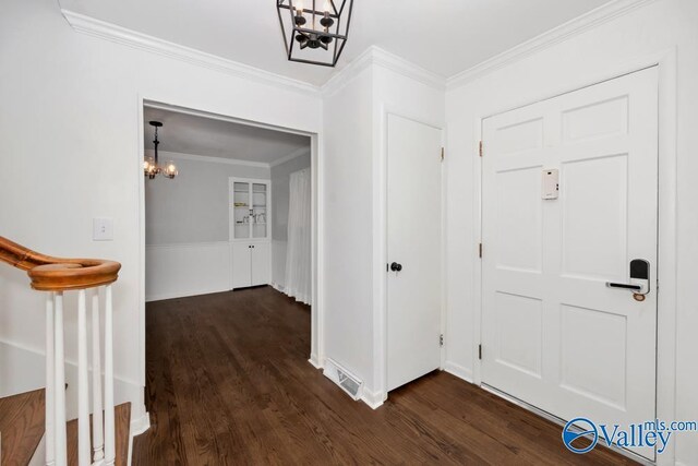 2512 Vista Dr SE, Huntsville, AL 35803 - entryway featuring a chandelier, dark wood finished floors, and crown molding