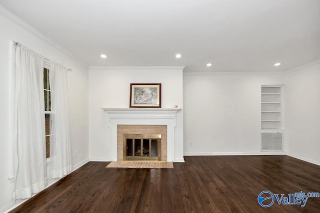 unfurnished living room with a fireplace, dark hardwood / wood-style floors, and crown molding