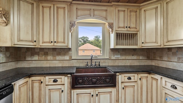 919 Colquitt Rd, Gadsden, AL 35903 - kitchen with stainless steel dishwasher, backsplash, and light brown cabinetry