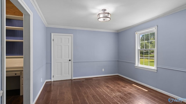 919 Colquitt Rd, Gadsden, AL 35903 - unfurnished bedroom featuring dark wood-type flooring and ornamental molding