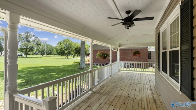 919 Colquitt Rd, Gadsden, AL 35903 - wooden porch with a ceiling fan and a yard