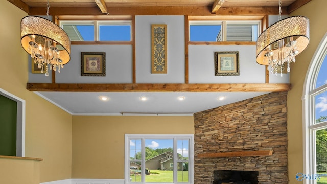 919 Colquitt Rd, Gadsden, AL 35903 - detailed view of a chandelier, beamed ceiling, and a stone fireplace