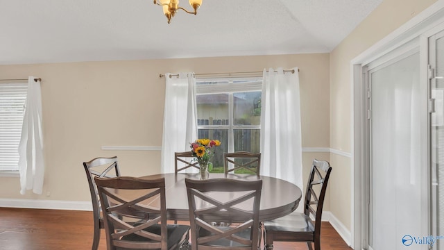 121 Oakline Dr, Madison, AL 35757 - dining room featuring wood finished floors, baseboards, and a chandelier