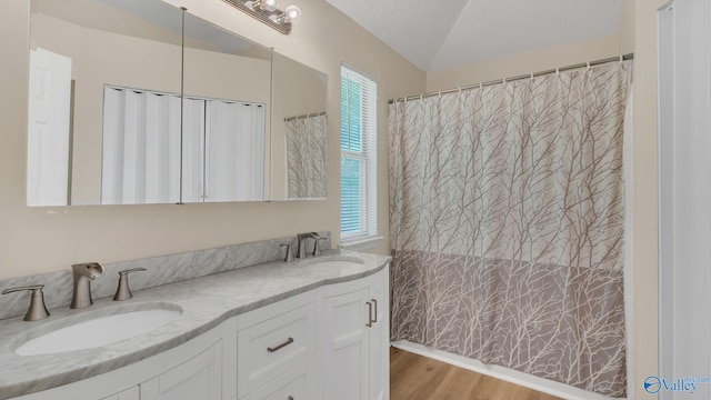 121 Oakline Dr, Madison, AL 35757 - bathroom with double vanity, wood finished floors, curtained shower, and a textured ceiling