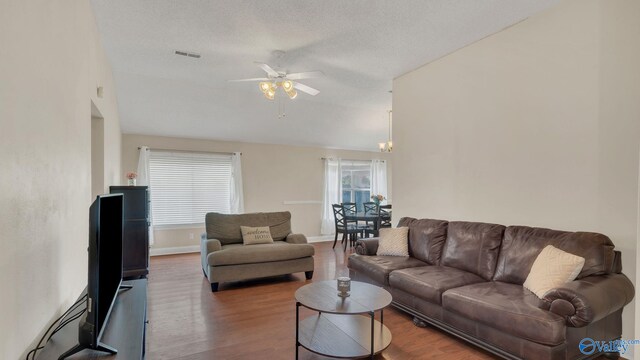 121 Oakline Dr, Madison, AL 35757 - living area featuring ceiling fan, wood finished floors, baseboards, and lofted ceiling