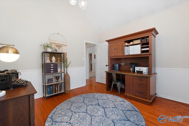 office area with dark hardwood / wood-style flooring and lofted ceiling