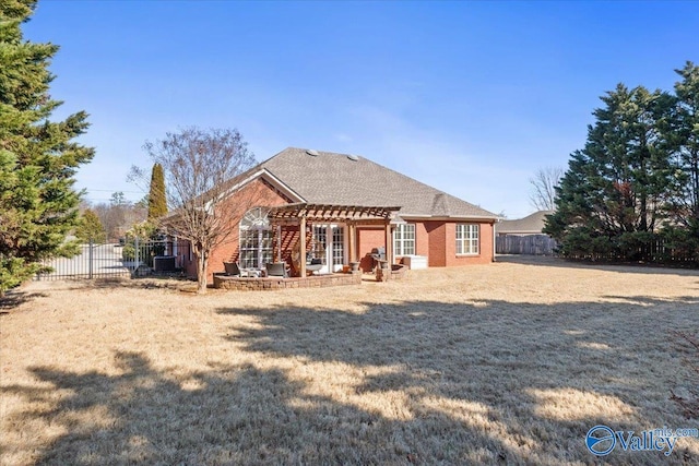 back of property featuring a pergola and a lawn